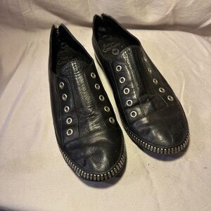 Colleen Cordero black leather slip ons, zips up the back, metal detail. 8.5